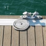 Welcome to KB Fisher & Co Blog: Living in Lake Norman Type of rope cleat found on Lake Norman dock with water in the background.