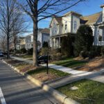 Tree-lined residential street in Summers Walk neighborhood Davidson North Carolina with neo-traditional homes