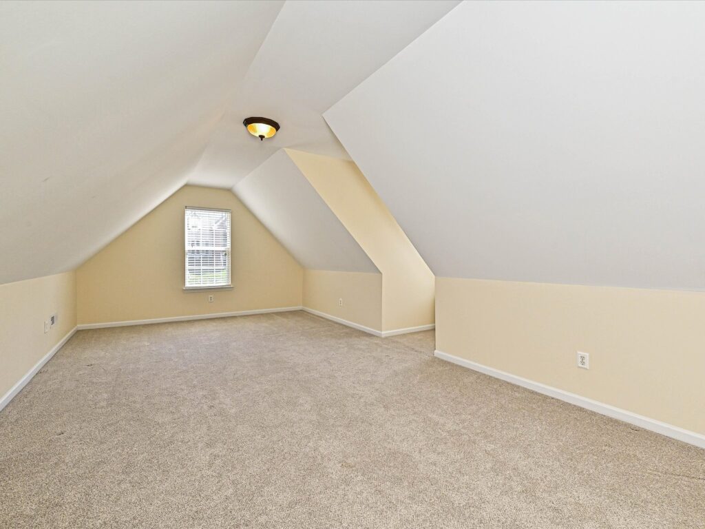 Upstairs bonus room with dormer window and natural light at 132 Gray Cliff Drive Mooresville
