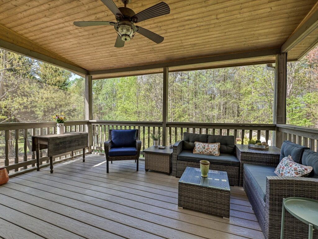 Screened porch with wood ceiling and ceiling fan overlooking fenced backyard at 132 Gray Cliff Drive