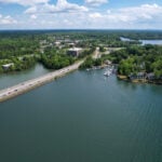 Aerial view of Interstate 77 crossing Lake Norman near Davidson NC with waterfront condos, restaurants and marina