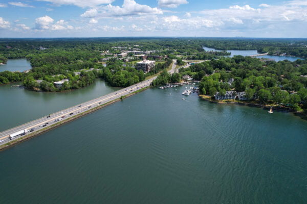 Aerial view of Interstate 77 crossing Lake Norman near Davidson NC with waterfront condos, restaurants and marina