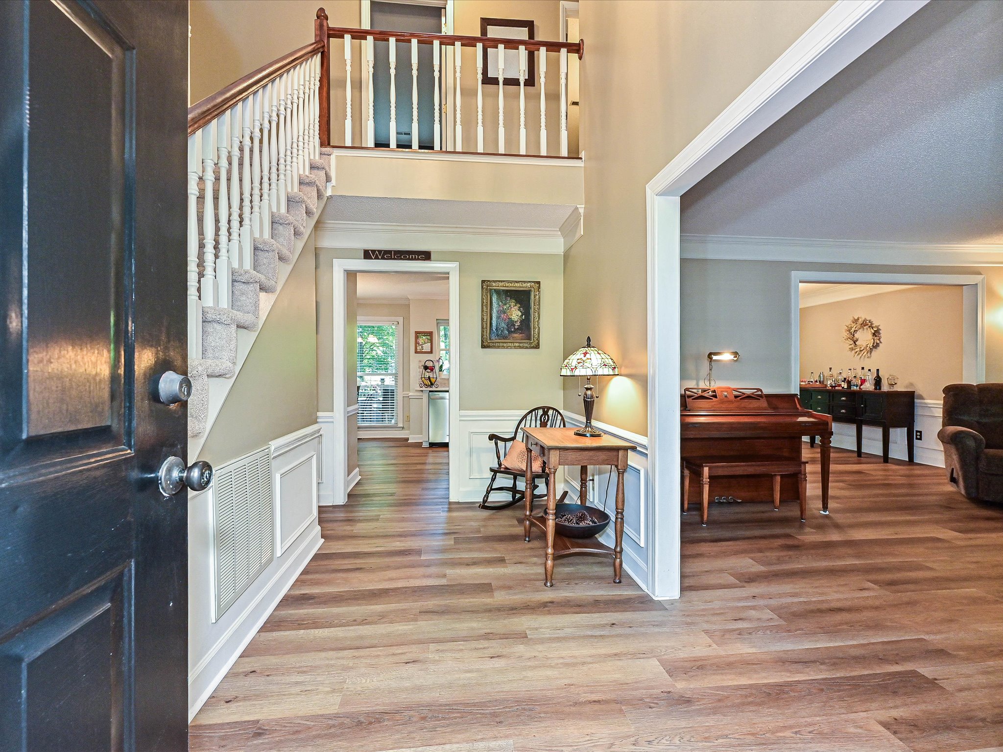 Two-story foyer with traditional molding in a Cedarfield home