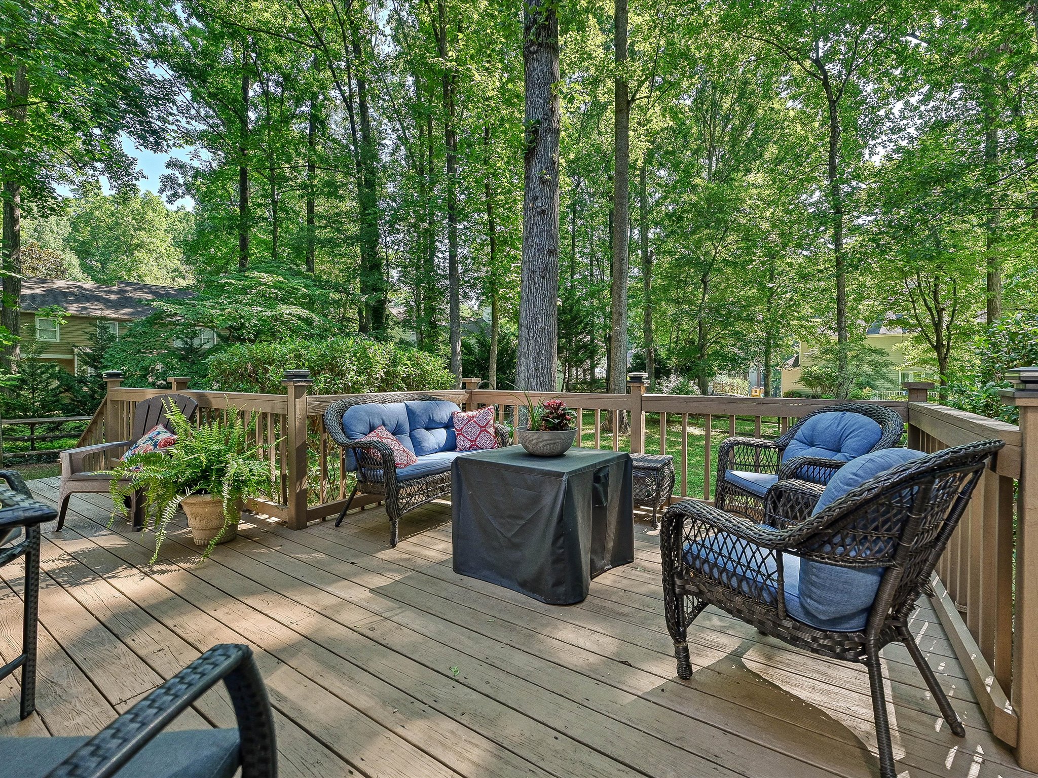 Back deck overlooking the fenced backyard of a Cedarfield home